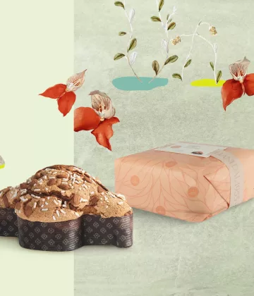 Colombe de Pâques Classique de 750g présentée avec son emballage dans un décore de Pâques.