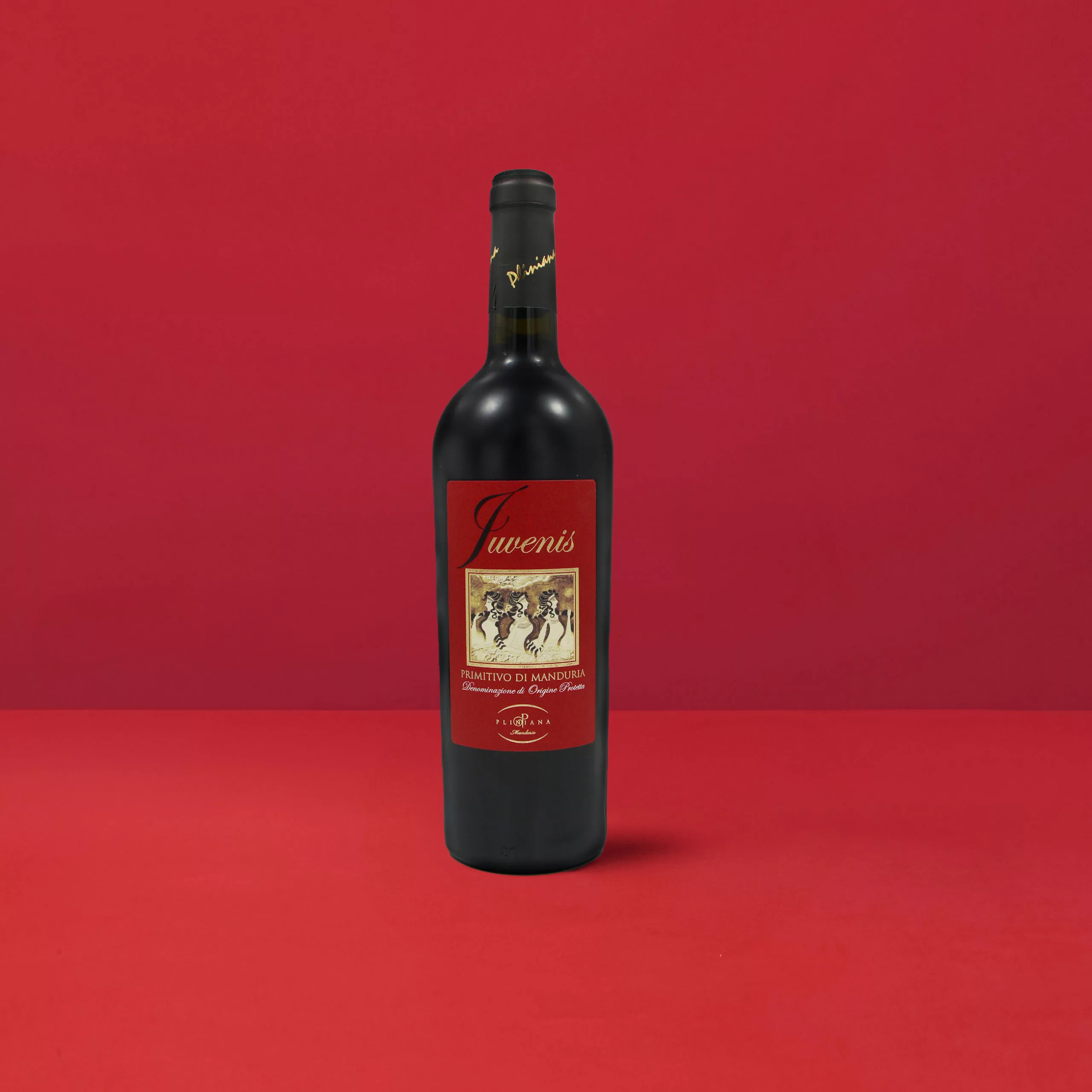 Bouteille de Primitivo di Manduria Juvenis DOP exprimant le rouge rubis intense et la vitalité du vin de Manduria