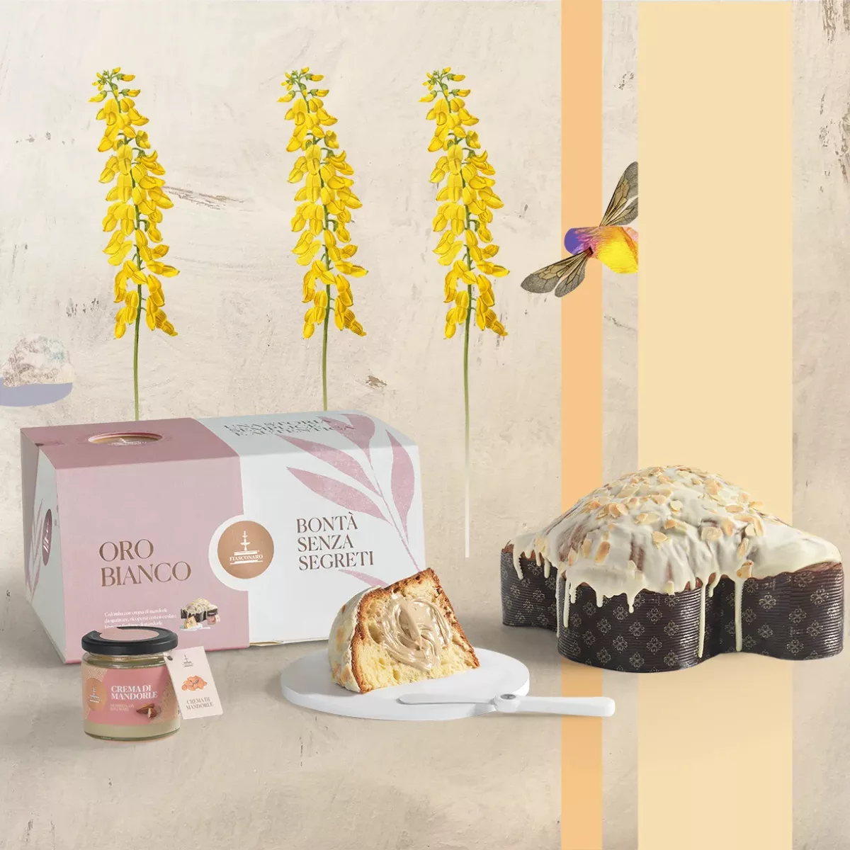 Colombe de Pâques Oro Bianco de Fiasconaro avec sa couverture de chocolat blanc et amandes, présentée avec son pot de crème et son spalmino